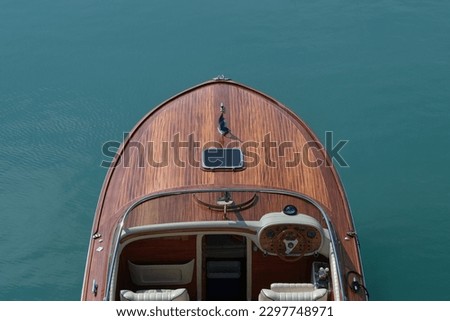 Front deck Luxurious lacquered wooden big boat on the water top view. Royalty-Free Stock Photo #2297748971