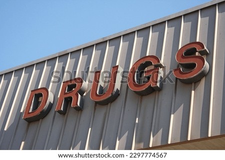 Vintage Drugs Sign on Outside of Retail Market Store