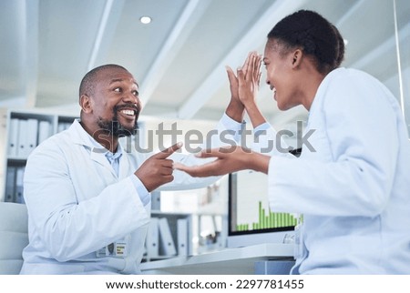 Amazing things happen when brilliants minds come together. two scientists giving each other a high five in a lab. Royalty-Free Stock Photo #2297781455