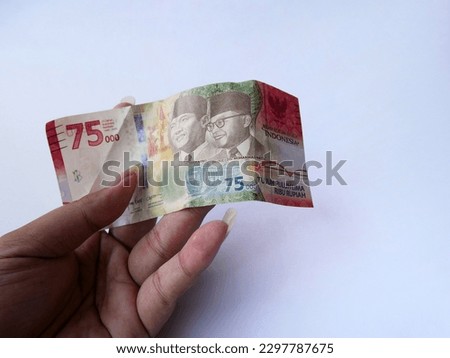 The new currency of the Indonesian Rupiah 75000 Limited edition for Celebration the 75th of The Independence Day of the Republic of Indonesia white isolated background