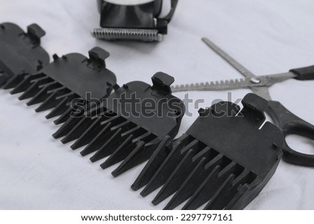 clipper tool Equipment for cutting hair and scissors for the technician, stacked together.


