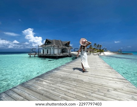 Happy a holiday in Summer blue trend with young woman in hat at happy freedom lifestyle  at Maldives beach