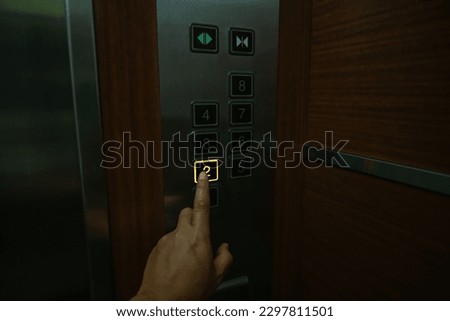 Selective focus at number 2 of lift passenger control panel. Royalty-Free Stock Photo #2297811501