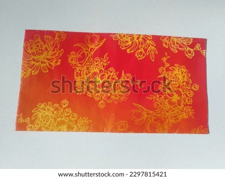 Envelopes containing money distributed during Eid with various cartoon character images to attract the attention of young children. Isolated white background.