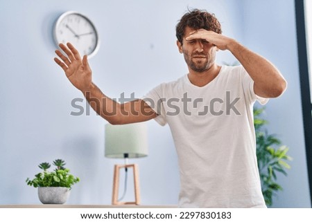 Young man suffering dizzy at home Royalty-Free Stock Photo #2297830183