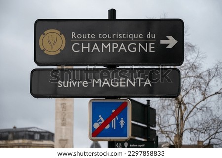 Low season in winter in Champagne wine making region near Reims, Champagne, France. Road signes and places of destinations, Gran Cru village, black road sign english translation: tourists route