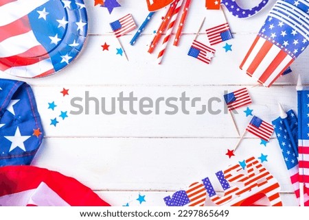 Happy Labor Day, Presidents Day, Fourth of July Independent holiday, Memorial day, Columbus day background. White wooden background with USA flag color paper fans and decorations, party accessories