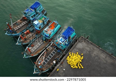 asian fisherman boat ,docks at the harbor