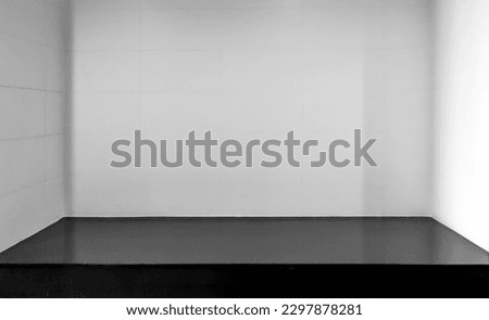 Black shelf and white wall Royalty-Free Stock Photo #2297878281