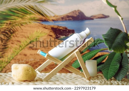 Funny picture of white blank sunscreen bottle sit on sun chair and sunbathe with palm trees and nature on background.