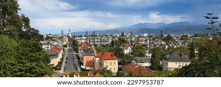 Klagenfurt cityscape panorama in Austria. Karawanks Alps range in background (Karawanken). Royalty-Free Stock Photo #2297953787