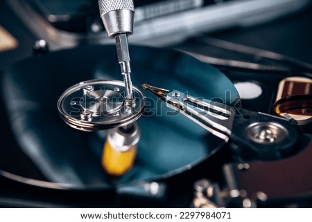 Computer service engineer technician workplace repairing fixing disassembled HDD hard drive data disc SSD, backup part of PC or laptop. Recovery, maintenance work, access file. Profession repairman

