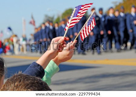 Flags at Veteran's Day Parade Royalty-Free Stock Photo #229799434