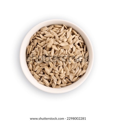 black bowl filled with white sunflower seeds, isolated on white background with clipping path, top view