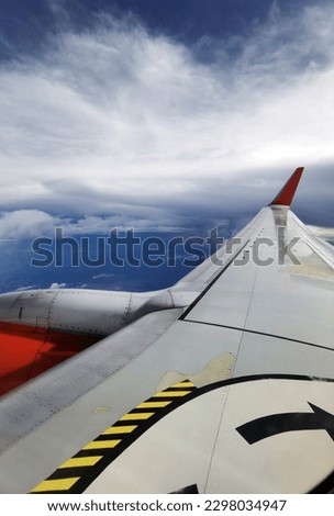  cloud blue sky with Wing of an airplane. Photo applied to tourism operators. picture for add text message or frame website. Traveling concept

