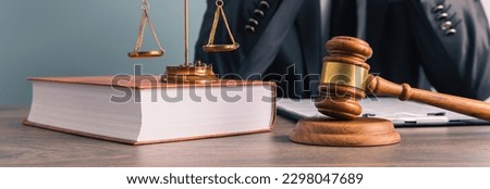 Law and justice concept, lawer holding document with wooden gavel
