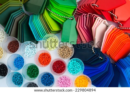 several dyed plastic polymer granulates in laboratory Royalty-Free Stock Photo #229804894