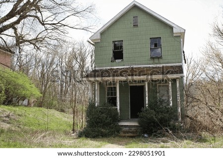 An abandoned house that resides in an abandoned village from an old miners town. Royalty-Free Stock Photo #2298051901