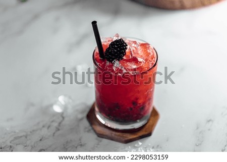Bramble Cocktail refreshing gin, lemon juice, syrup and blackberries Royalty-Free Stock Photo #2298053159