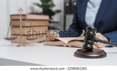Young single female lawyer asian people in formal suit real estate working law book and contract documents, Arguments for Defense Strategy. Fight for Freedom. Supporting Evidence. Royalty-Free Stock Photo #2298082283
