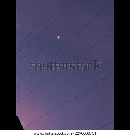 The moon at the purple sky