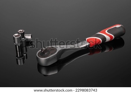 Close-up ratchet wrench. Professional tool. Isolated on a black background. Royalty-Free Stock Photo #2298083743