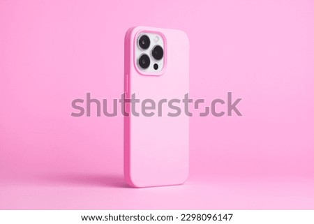 iPhone 14 pro max and 13 in light pink case back side view isolated on pink background, monochrome colors phone cover mock up