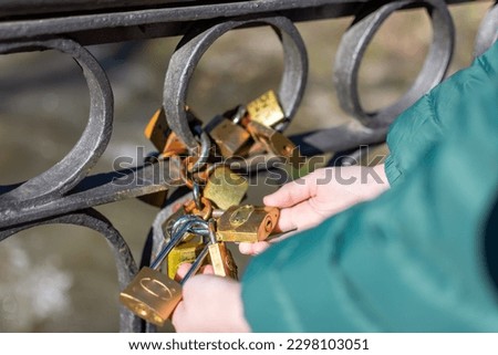Close up of love locks in a row.  Love padlocks on a bridge in Vrnjacka Banja, Serbia.