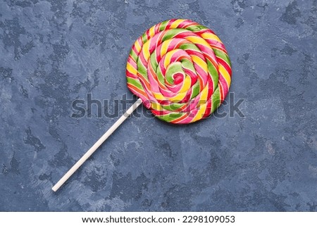Colorful lollipop on blue grunge table