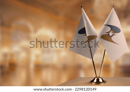 Small flags of the Eurasian Economic Union on an abstract blurry background. Royalty-Free Stock Photo #2298120149