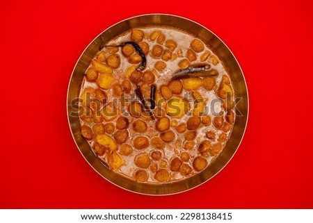 Soyabean curry with potatoes. Most Indian vegetarians prefer this dish. It is a very protein rich food. Its taste is very similar to meat. Shown in the picture in a steel bowl.