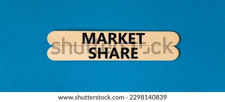 Market share symbol. Concept words Market share on beautiful wooden stick. Beautiful blue table blue background. Business and Market share concept. Copy space.