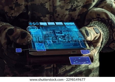 AI Command of the military forces on the tablet computer with augmented reality. Internet, Programming control with artificial intelligence, online coordination of the military team Royalty-Free Stock Photo #2298149677