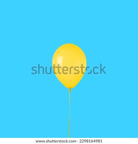 Yellow balloon on a blue background 