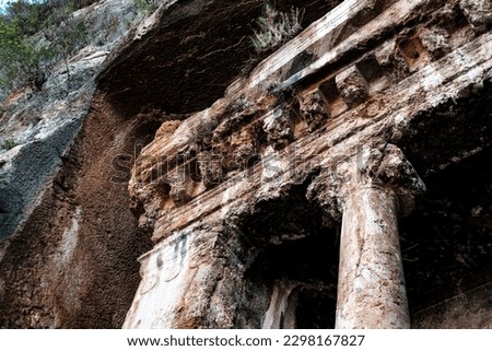 Lycian cave tombs in rocks close up details, ancient civilization architecture, Tomb of Amyntas entrance in Fethiye Royalty-Free Stock Photo #2298167827