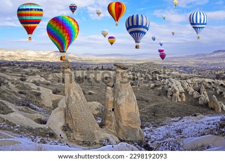 Hot air balloon flying over spectacular Cappadocia, Uchisar - Goreme, Turkey                              