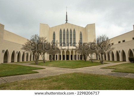 Beaumont First United Methodist Church with Gothic arches and a spire in Beaumont, Texas, USA Royalty-Free Stock Photo #2298206717