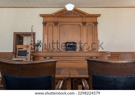 American courtroom. justice and law. chairs and judge table Royalty-Free Stock Photo #2298224579