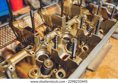 The iron gearbox of a car s transmission disassembly of the transmission chain and parts, repair