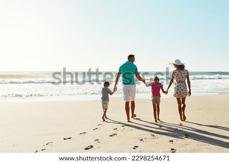 Summer days were made for the beach. a family enjoying some quality time together at the beach. Royalty-Free Stock Photo #2298254671