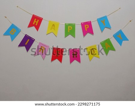 happy birthday inscription with colorful letters as a birthday decoration attached to the wall