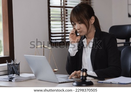 Advice and Legal services Concept. Judge gavel with Justice lawyers, Businesswoman in suit or lawyer working with laptop at desk.