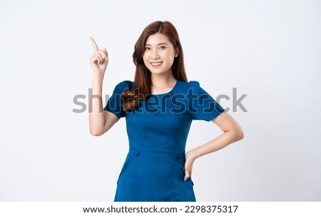 Asian girl portrait in blue dress on white background