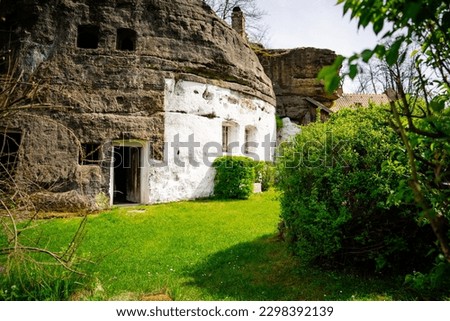 The old rock dwelling located near the village of Lhotka u Mělníka was carved into sandstone as an emergency shelter, probably around the turn of the 17th and 18th centuries. Royalty-Free Stock Photo #2298392139
