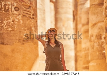 Tourist woman in Karnak Temple in Luxor Egypt Royalty-Free Stock Photo #2298397345