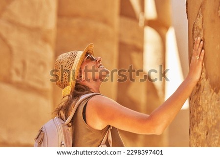 Tourist woman in Karnak Temple in Luxor Egypt Royalty-Free Stock Photo #2298397401