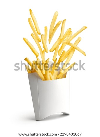 French fries bursting out from white paper box isolated on white Royalty-Free Stock Photo #2298401067