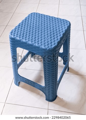 plastic chairs with woven bamboo motifs