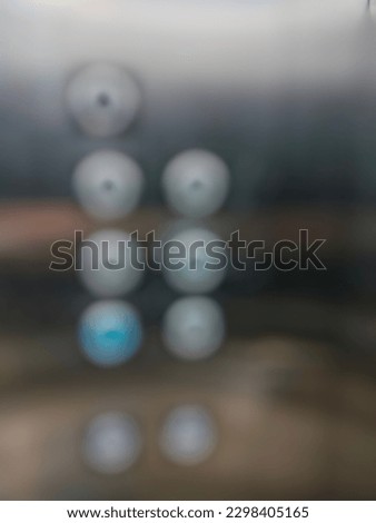 Defocused photo of elevator buttons inside an elevator