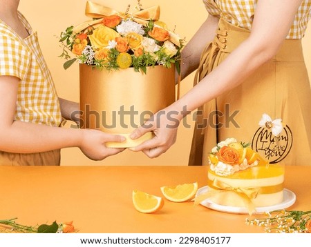 Mother's day, daughter sends flowers and cake to mom, sweet family image, warm tones(Asian)